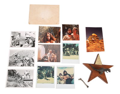 Lot #490 - CAVEMAN (1981) - Ringo Starr and Barbara Bach Dinosaur and Bone-pendant Crew Gift, 10 On-set Photographs and Autographed Note