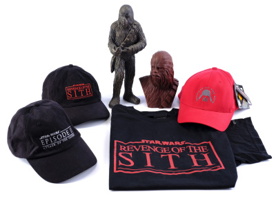 Lot #915 - STAR WARS: REVENGE OF THE SITH (2005) - ILM Crew Gift Castings of Chewbacca, Three Crew Hats and Crew Shirt